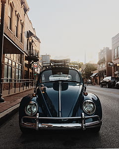 black Volkswagen Beetle park outside the house thumbnail