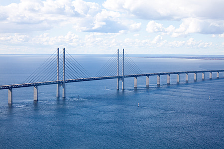 aerial view of gray concrete bridge on body of water thumbnail