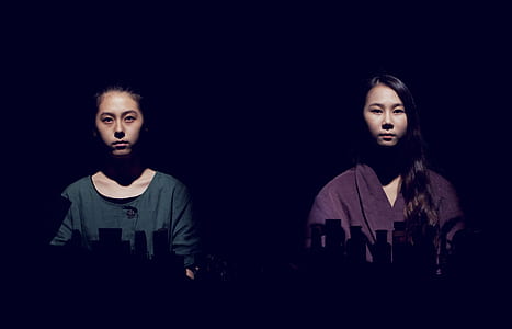 two women standing side by side thumbnail