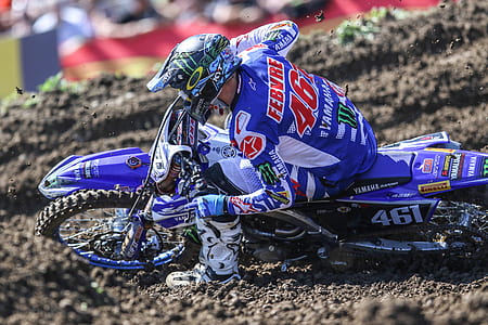 person riding on motocross dirtbike during daytime thumbnail