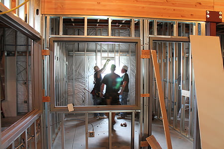 man wearing black shirt standing near gray steel frame thumbnail