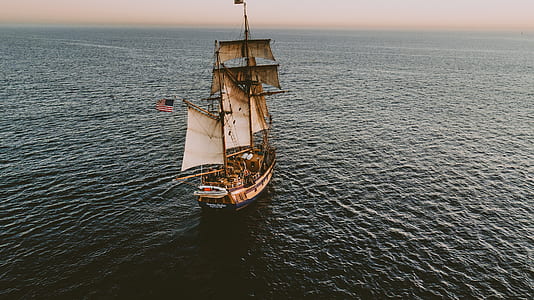 beige and white galleon ship on ocean thumbnail