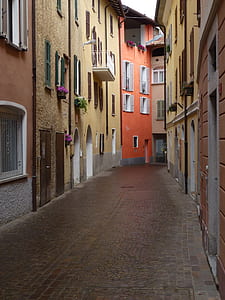 yellow and orange house with pathway during daytime thumbnail