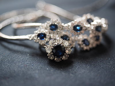 silver-colored, clear, and blue gemstone encrusted accessory thumbnail