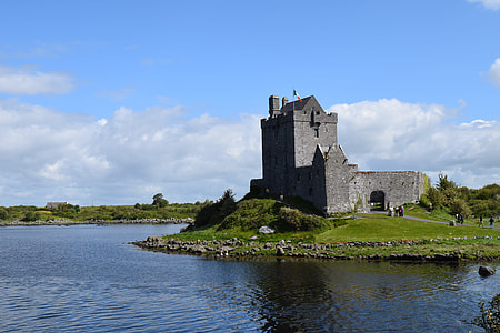 gray stone castle near body of water thumbnail