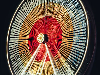 red, blue, and brown Ferris Wheel with black background thumbnail