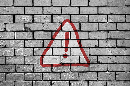 warning signage on wall thumbnail
