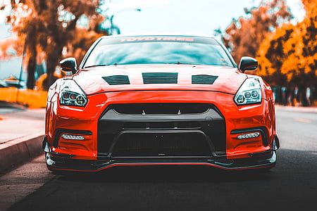 red Nissan GTR parked on road thumbnail