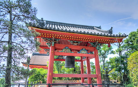 red pagoda surrounded with trees thumbnail