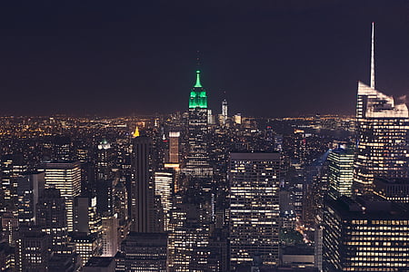 city buildings with lights during nighttime thumbnail