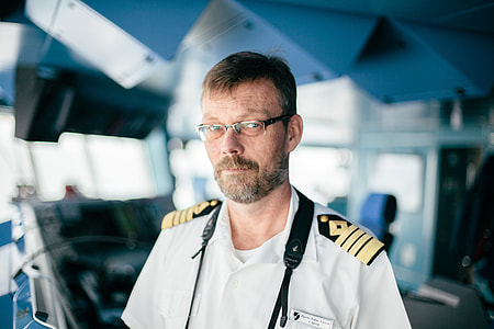 selective focus photography of man wearing white uniform thumbnail