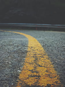 selective focus photography of road at daytime thumbnail