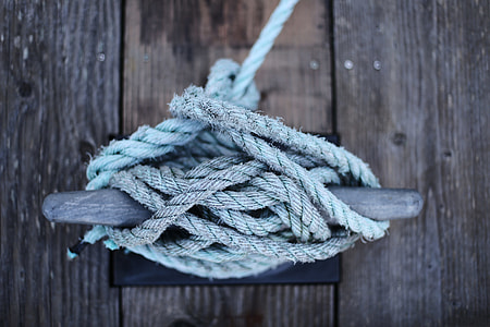 closeup photo of gray rope tied on gray hook thumbnail