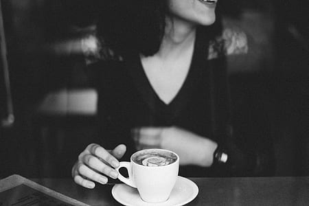 woman sitting on chair white holding coffee mug on the table thumbnail