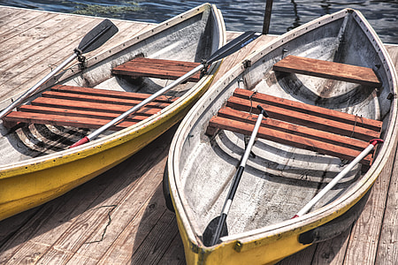 photography two yellow-and-brown wooden canoes during daytime thumbnail