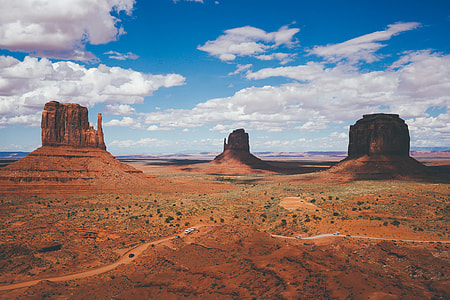 three brown rocky mountain aerial photography thumbnail