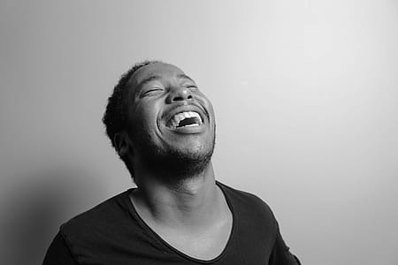 Grayscale Photograph of Man Laughing thumbnail