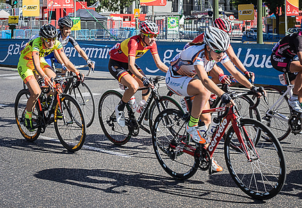 six cyclists in the middle of the road during day thumbnail