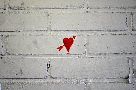 white brick wall with red heart painting thumbnail