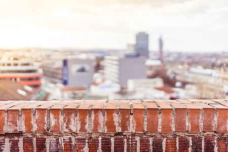 Empty Brick Wall with Blurred City View Background thumbnail