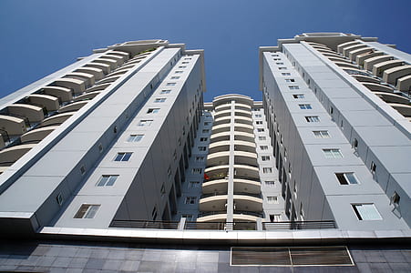 low angle photography of gray high-rise building thumbnail
