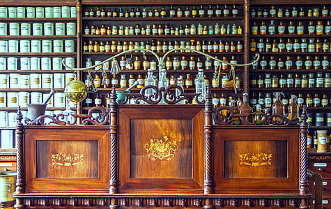 brown wooden sideboard with assorted bottles thumbnail