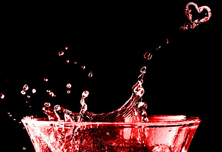 time lapse photo of red liquid splash from clear drinking glass thumbnail