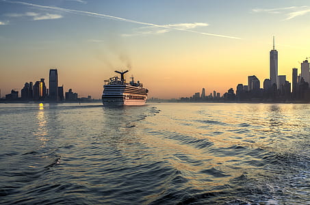 white luxury boat on body of water during sunset thumbnail