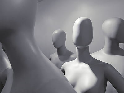selective focus photo of white mannequins inside white room thumbnail
