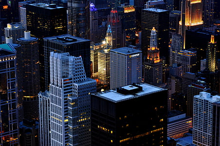 aerial photography of high-rise buildings during night time thumbnail