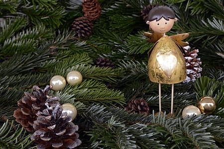 angel, pinecone and bauble ornaments hanged on christmas tree thumbnail