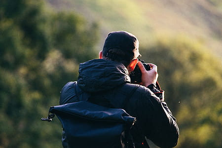 person using his camera thumbnail