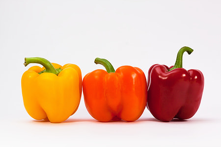 three bell peppers on white surface thumbnail