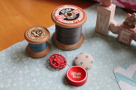 two gray and blue thread spools thumbnail