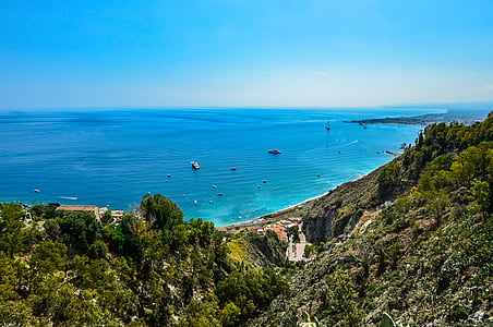 top view of beach beside mountain thumbnail