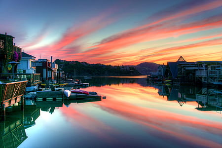 body of water in between residential buildings thumbnail