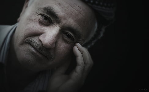 woman holding his face with black background thumbnail