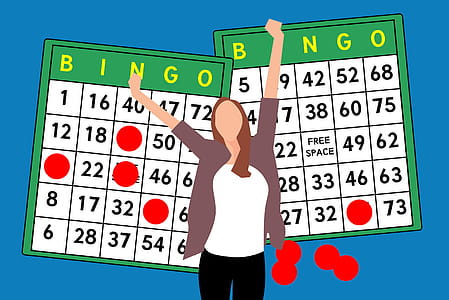 Illustration of woman with bingo cards, in winning pose. thumbnail