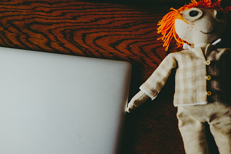MacBook and handmade doll thumbnail