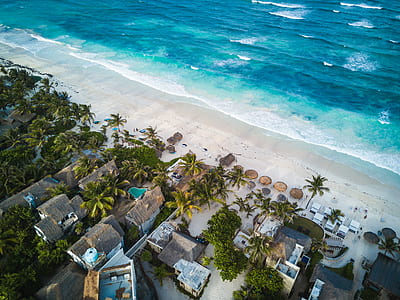 aerial photography of blue and white ocean wave with white sand thumbnail