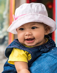 smiling baby on persons shoulder thumbnail