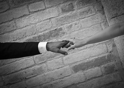 man and woman holding hands thumbnail