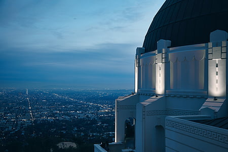 white concrete dome building under blue sky thumbnail