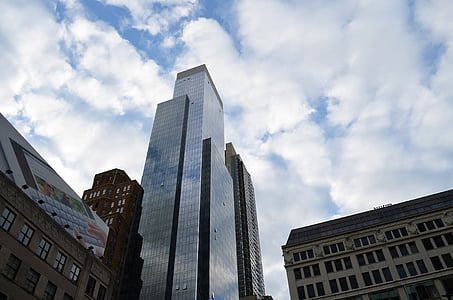 concrete building under cloudy sky thumbnail