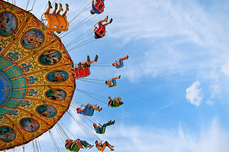 time lapse photography of circus rides during daytime thumbnail