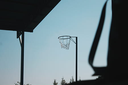 selective focus photography of boardless basketball hoop outdoor thumbnail