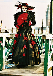 woman in black and red floral maxi dress on wooden bridge thumbnail