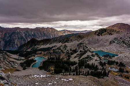 bird's eyeview photo of mountain with body of water thumbnail