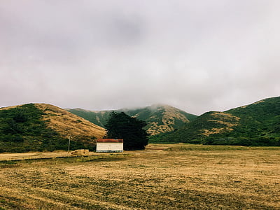 white house beside mountain thumbnail