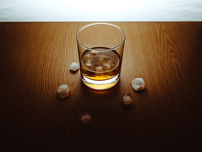 clear drinking glass on brown surface thumbnail